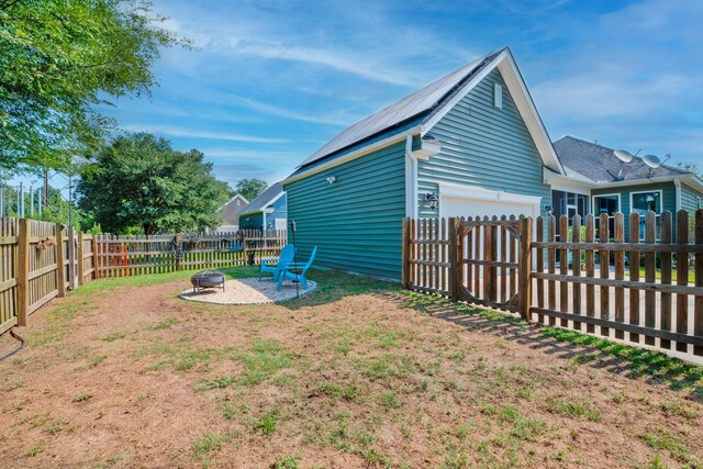 1589 Seabago Dr, Charleston, SC 29414 - fenced backyard featuring an outdoor fire pit