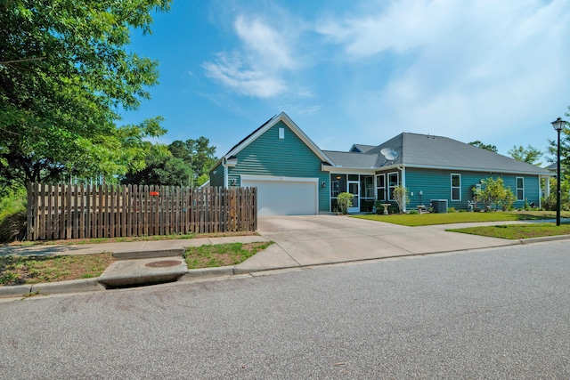 1589 Seabago Dr, Charleston, SC 29414 - view of front of house with concrete driveway, a garage, and central AC
