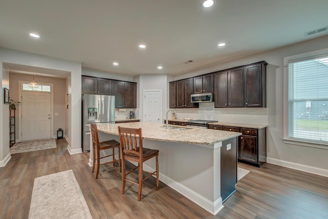 1589 Seabago Dr, Charleston, SC 29414 - kitchen featuring stainless steel appliances, a sink, dark brown cabinets, wood finished floors, and baseboards
