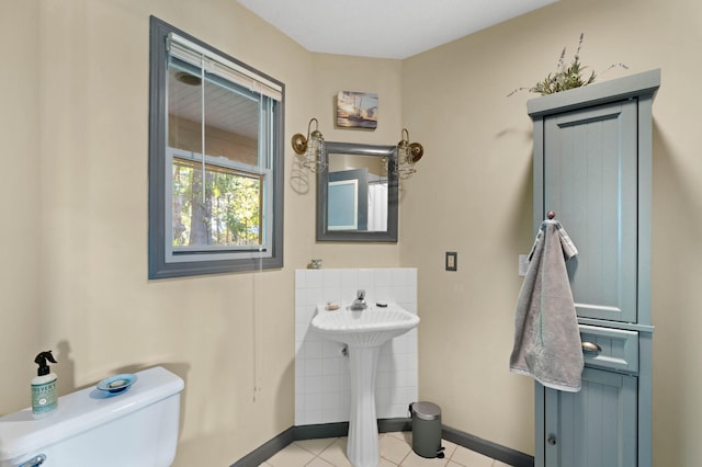 bathroom featuring toilet and tile patterned floors