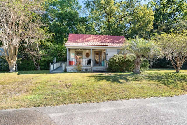 view of front facade with a front yard and covered porch