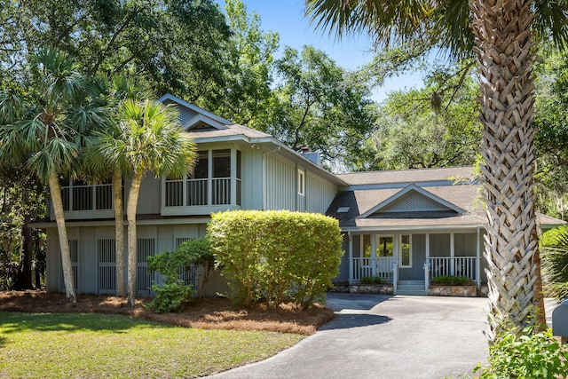 33 Painted Bunting Ln, Kiawah Island, SC 29455 - view of front of property featuring a porch, driveway, and a chimney