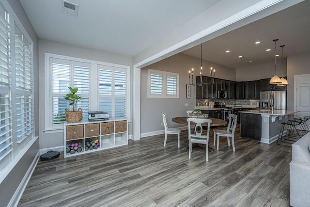 dining room with hardwood / wood-style floors