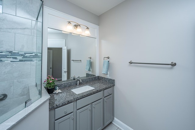 bathroom with vanity and a shower