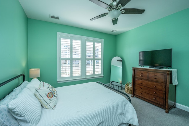 bedroom featuring ceiling fan and light colored carpet