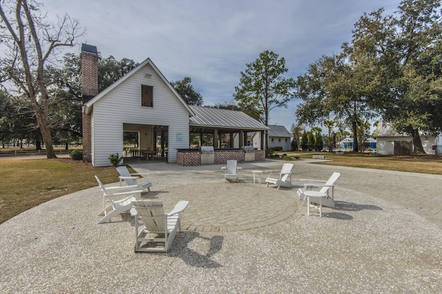 back of house featuring a patio area