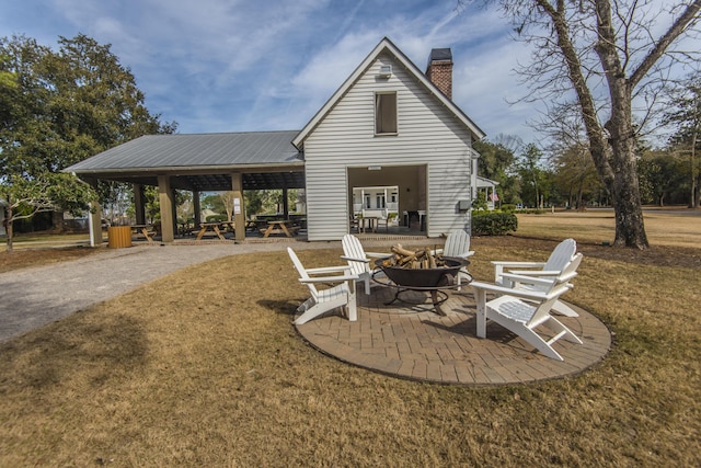 view of patio with a fire pit