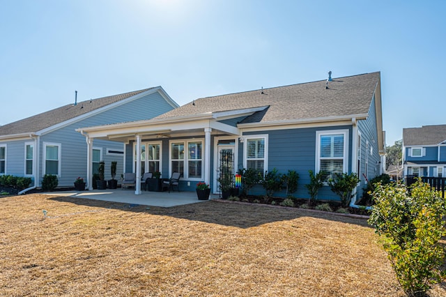 ranch-style house featuring a front lawn and a patio area