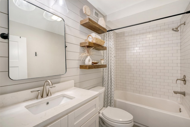 full bathroom with vanity, shower / bath combination with curtain, wooden walls, and toilet