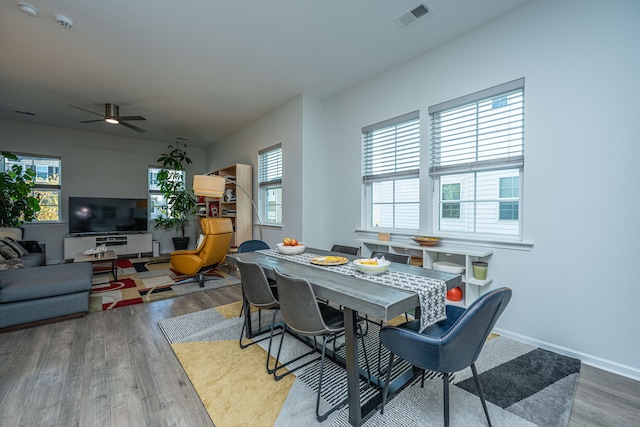 dining room featuring ceiling fan and wood-type flooring