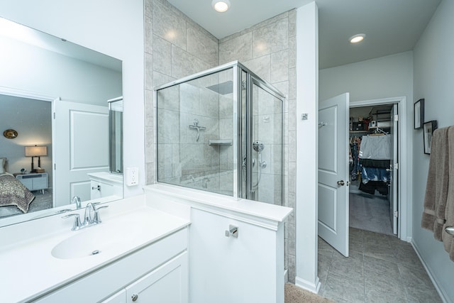 bathroom with vanity, tile patterned flooring, and an enclosed shower