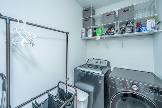 washroom with washer and dryer