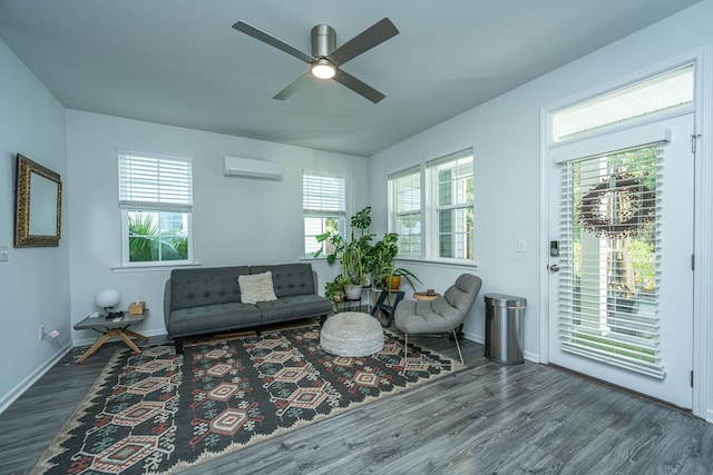 living room featuring dark wood-type flooring, a wall mounted AC, and ceiling fan