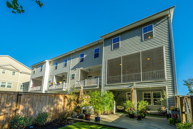 rear view of house featuring a balcony