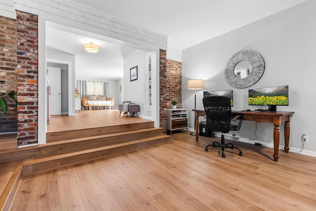 office area featuring baseboards and wood finished floors