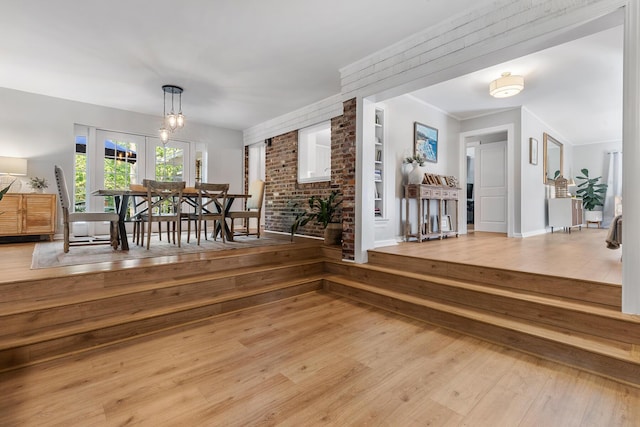 interior space featuring built in shelves and wood finished floors