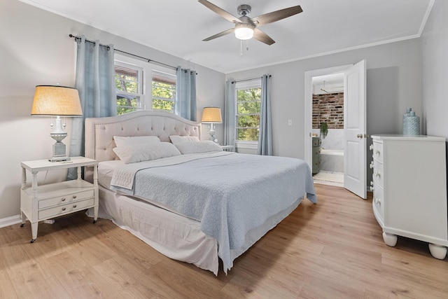 bedroom with light wood-style floors, crown molding, and multiple windows