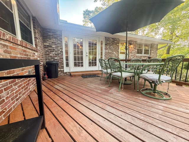 deck featuring french doors and outdoor dining area