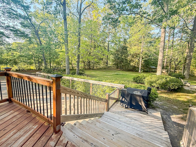 wooden terrace with a yard