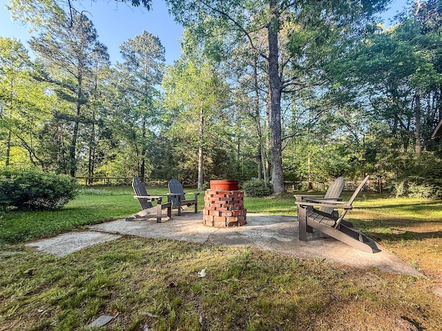 view of yard with a patio area and a fire pit