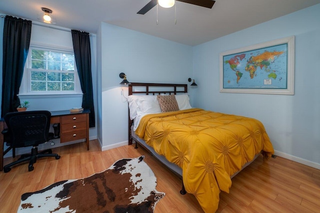 bedroom featuring light wood-type flooring and ceiling fan