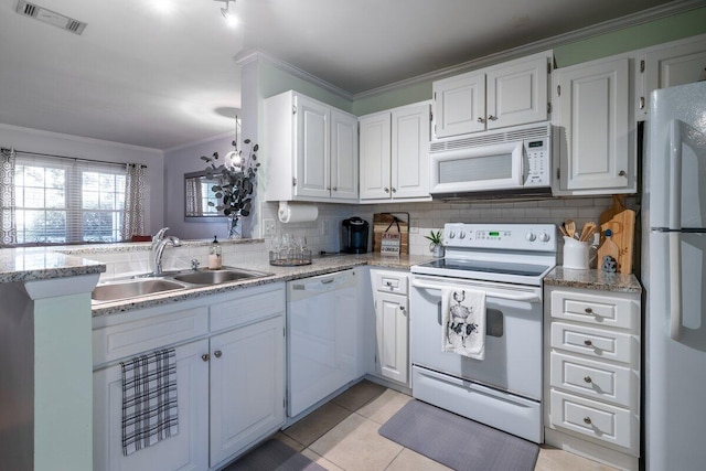 kitchen featuring white appliances, white cabinets, sink, light tile patterned flooring, and crown molding