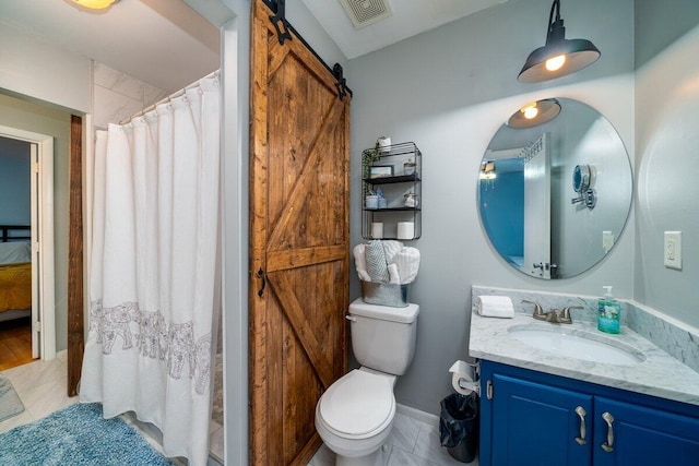 bathroom with vanity, toilet, and walk in shower