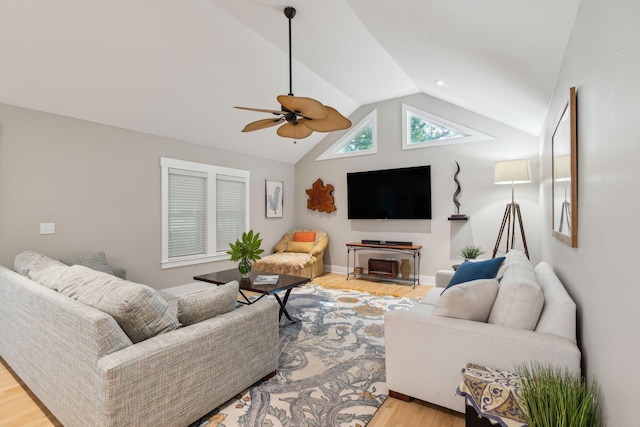 living room with light hardwood / wood-style flooring, ceiling fan, and lofted ceiling