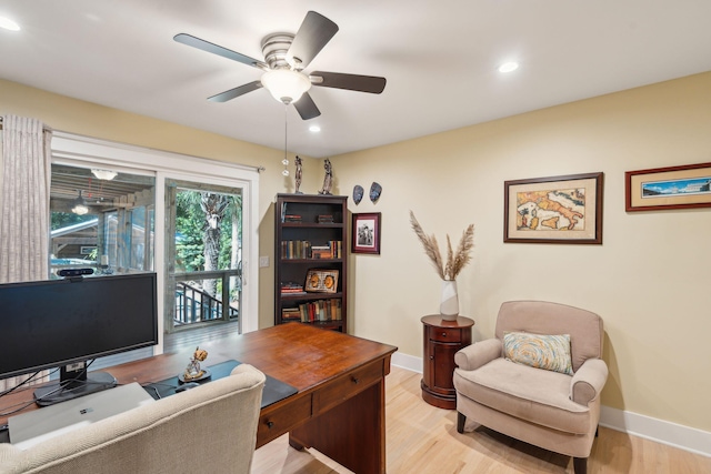 office featuring ceiling fan and light hardwood / wood-style flooring