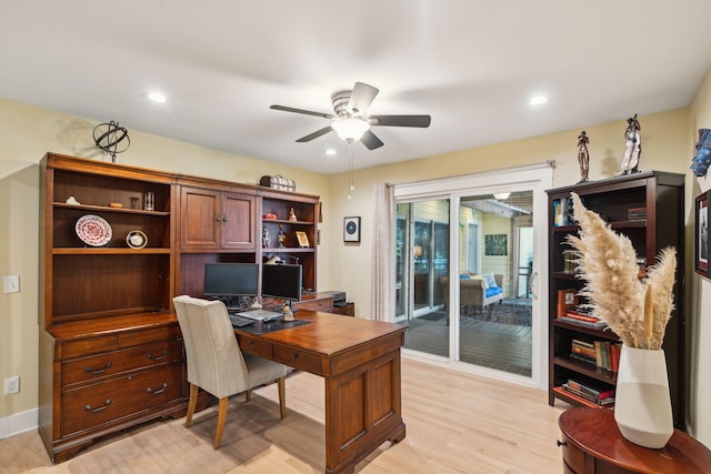 office space featuring ceiling fan and light hardwood / wood-style flooring