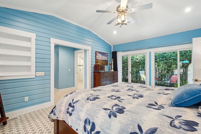 bedroom with ceiling fan, wood walls, and vaulted ceiling