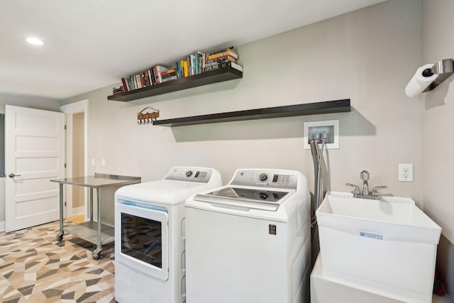 washroom featuring independent washer and dryer and sink