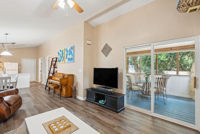 living room featuring ceiling fan and hardwood / wood-style flooring