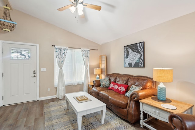 living room featuring hardwood / wood-style floors, a wealth of natural light, lofted ceiling, and ceiling fan