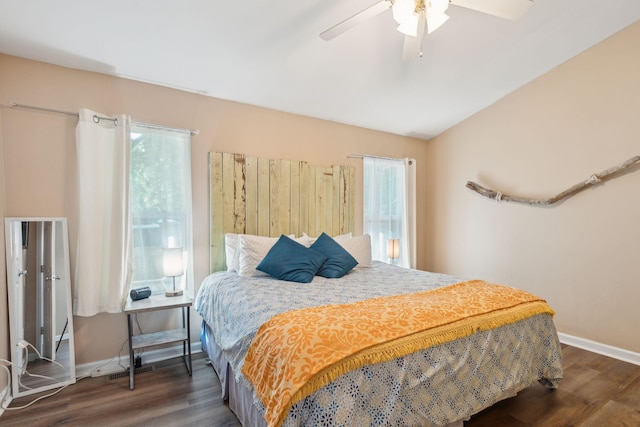 bedroom with ceiling fan and dark hardwood / wood-style floors