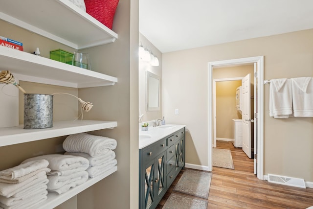 bathroom with vanity and wood-type flooring