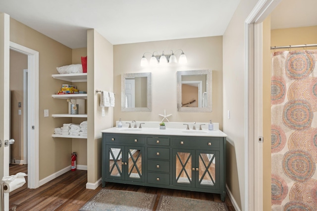 bathroom with vanity and hardwood / wood-style flooring