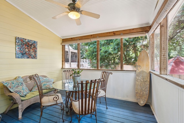 sunroom / solarium with ceiling fan and vaulted ceiling