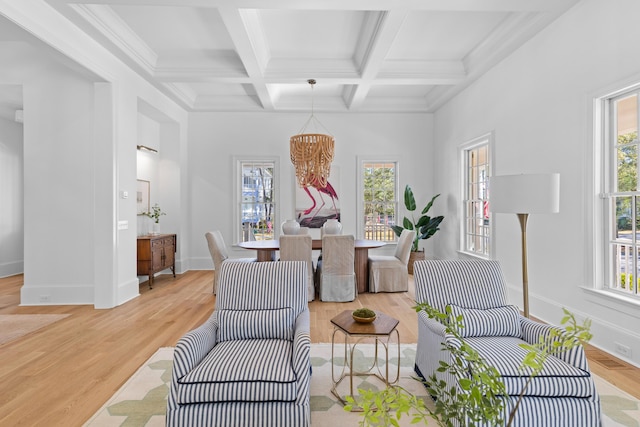 interior space with beamed ceiling, coffered ceiling, light wood-style flooring, and baseboards