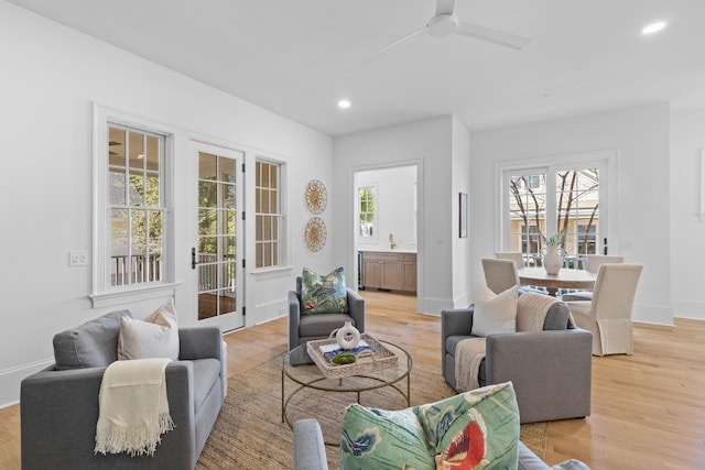 sitting room featuring recessed lighting, baseboards, and wood finished floors