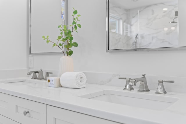 bathroom with double vanity and a sink