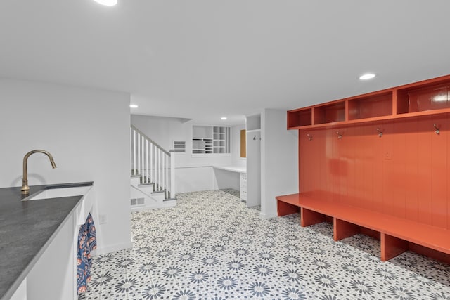 mudroom featuring light floors, visible vents, and recessed lighting