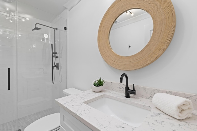 bathroom featuring a stall shower, vanity, and toilet