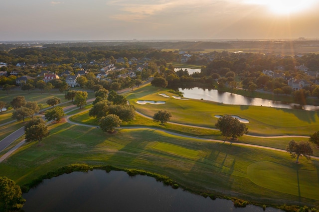 bird's eye view featuring a water view and golf course view