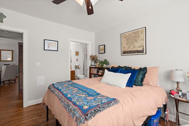 bedroom featuring ceiling fan, dark hardwood / wood-style flooring, and ensuite bath