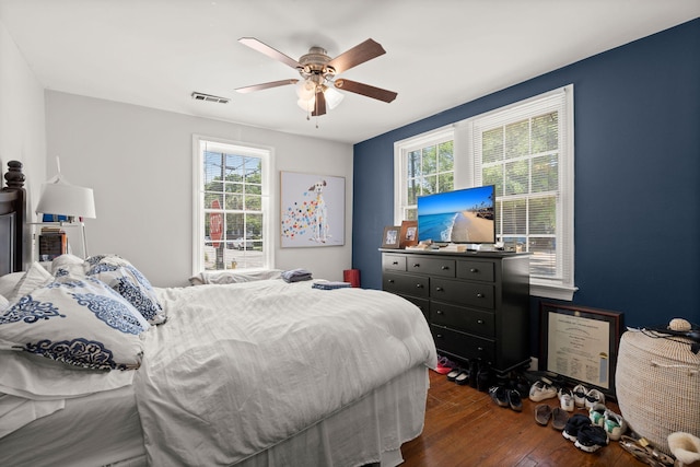 bedroom with dark wood-type flooring and ceiling fan