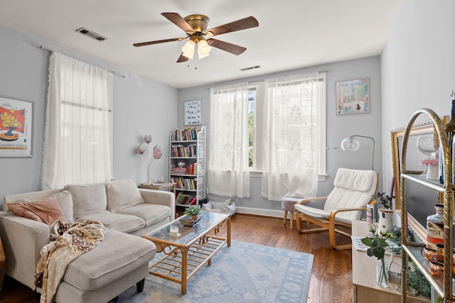 living room with ceiling fan and hardwood / wood-style floors