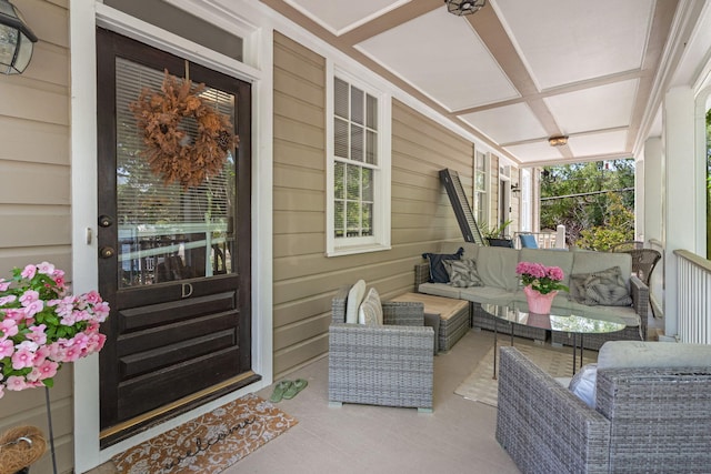 view of patio with an outdoor living space and a porch