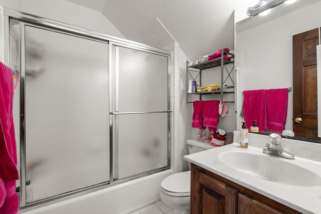 full bathroom with tile flooring, vaulted ceiling, shower / bath combination with glass door, toilet, and vanity