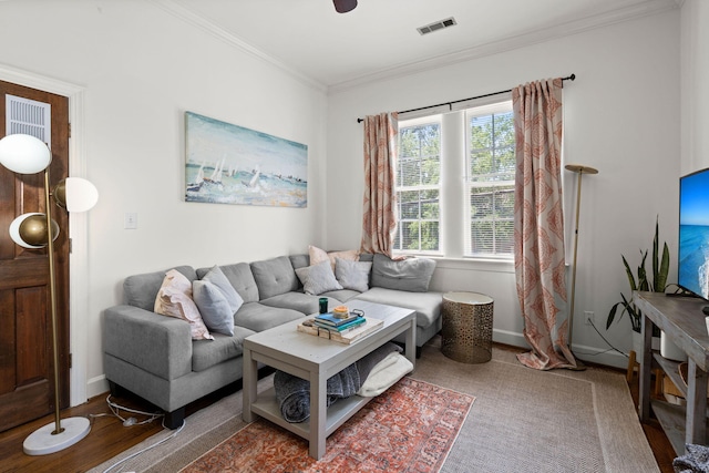 living room featuring wood-type flooring and ornamental molding